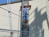 KB9INF0121 Scott KB9VRW setting a guy for the VHF tower (not the one he's standing on).