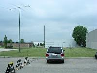 K9IJ1678 Gotta protect that coax. The two military towers and the 80M Vert